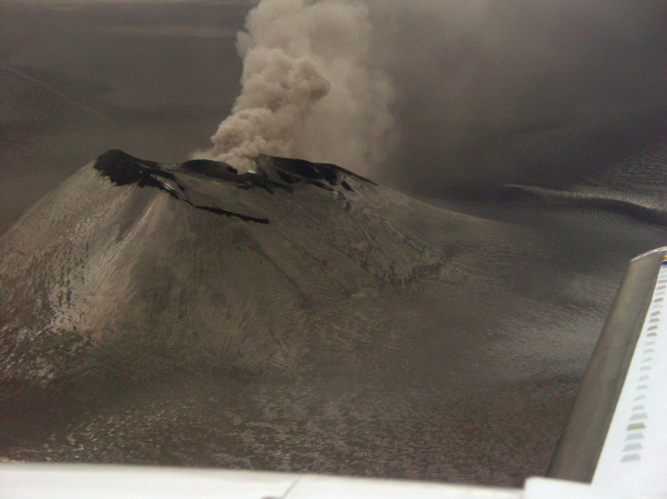 Veniaminof intracaldera cinder cone. Ash plume drifting to NE. Photo taken from a Navajo (Security Aviation) during an observational overflight. Elevation of cone is 7075 ft.